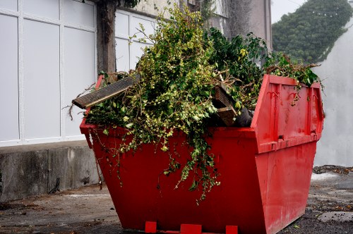 Commercial waste collection truck operating in Roehampton